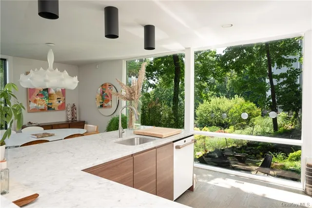 a room with furniture and wall paintings