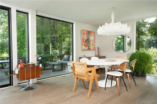 a backyard of a house with table and chairs