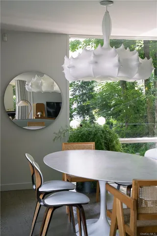 a view of a workspace with furniture and a living room