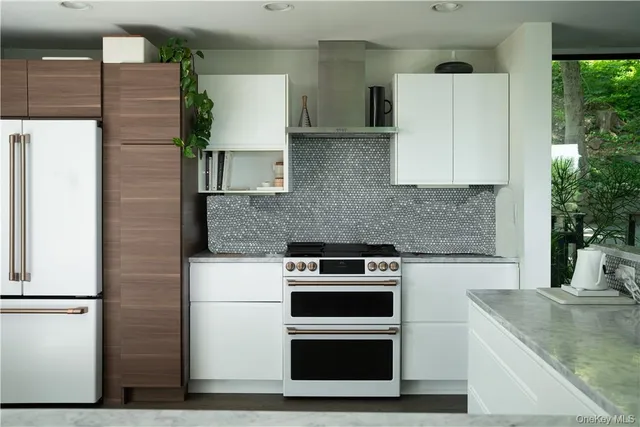 a kitchen with a stove and a refrigerator