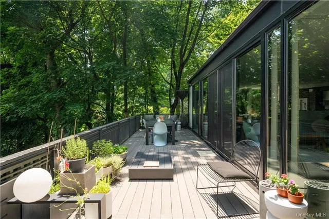 a view of balcony with furniture