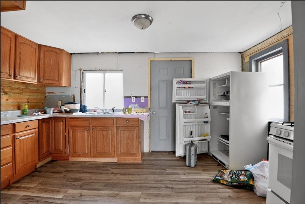 210 South High Street Havana, IL 62644 - Photo 9 of 17 a kitchen with stainless steel appliances a refrigerator and a stove top oven