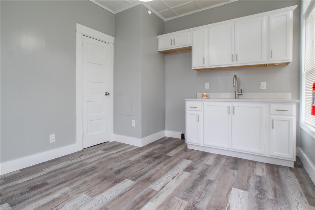 933 Philadelphia Road Easton, PA 18042 - Photo 20 of 23 Crisp cabinetry and wood-look flooring define this efficient preparation space.