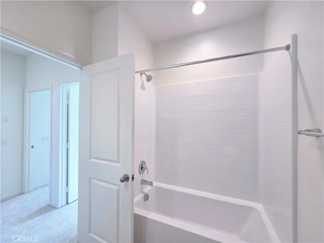 a view of an empty room and a window