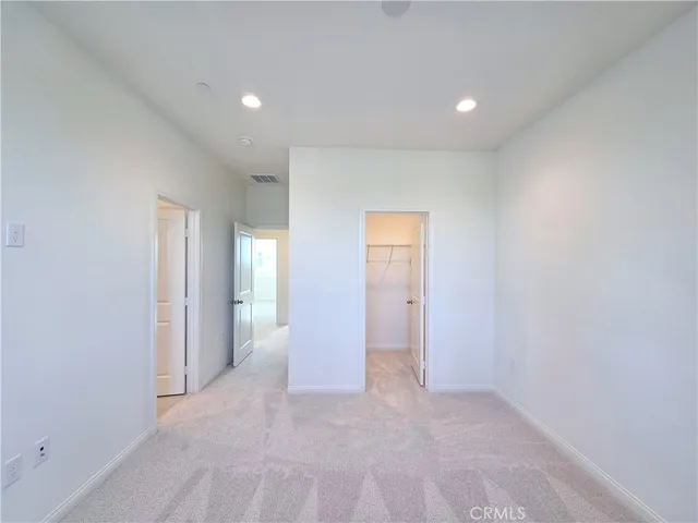 a bathroom with a shower a sink and a mirror