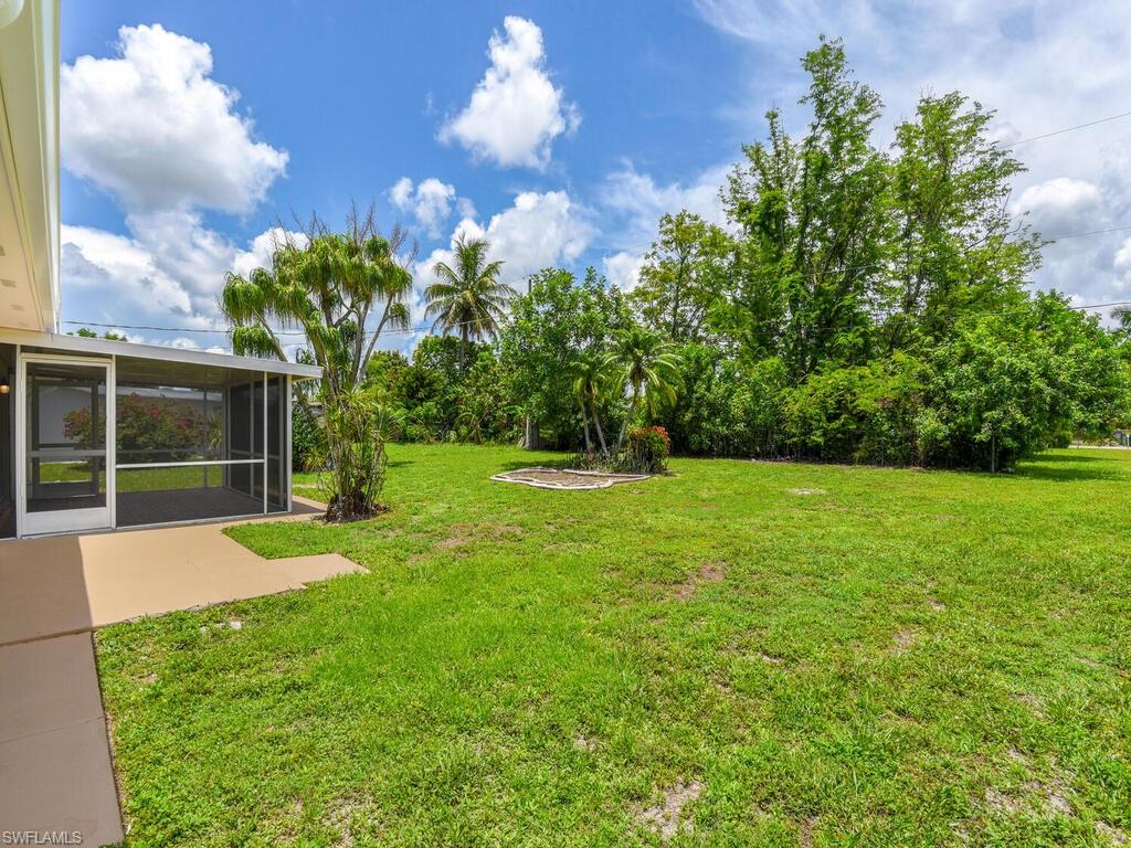 1958 41st Terrace Southwest Naples, FL 34116 - Photo 27 of 28 a view of a backyard with a garden
