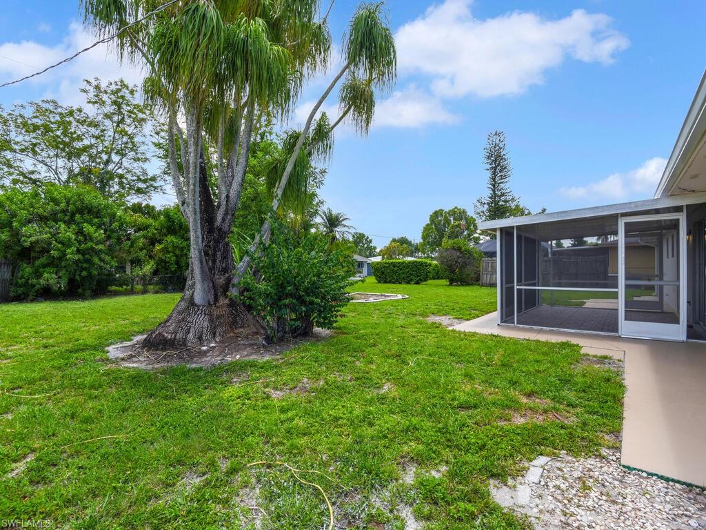 1958 41st Terrace Southwest Naples, FL 34116 - Photo 28 of 28 a front view of a house with a yard