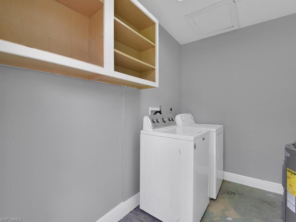 1958 41st Terrace Southwest Naples, FL 34116 - Photo 8 of 28 a utility room with dryer and washer