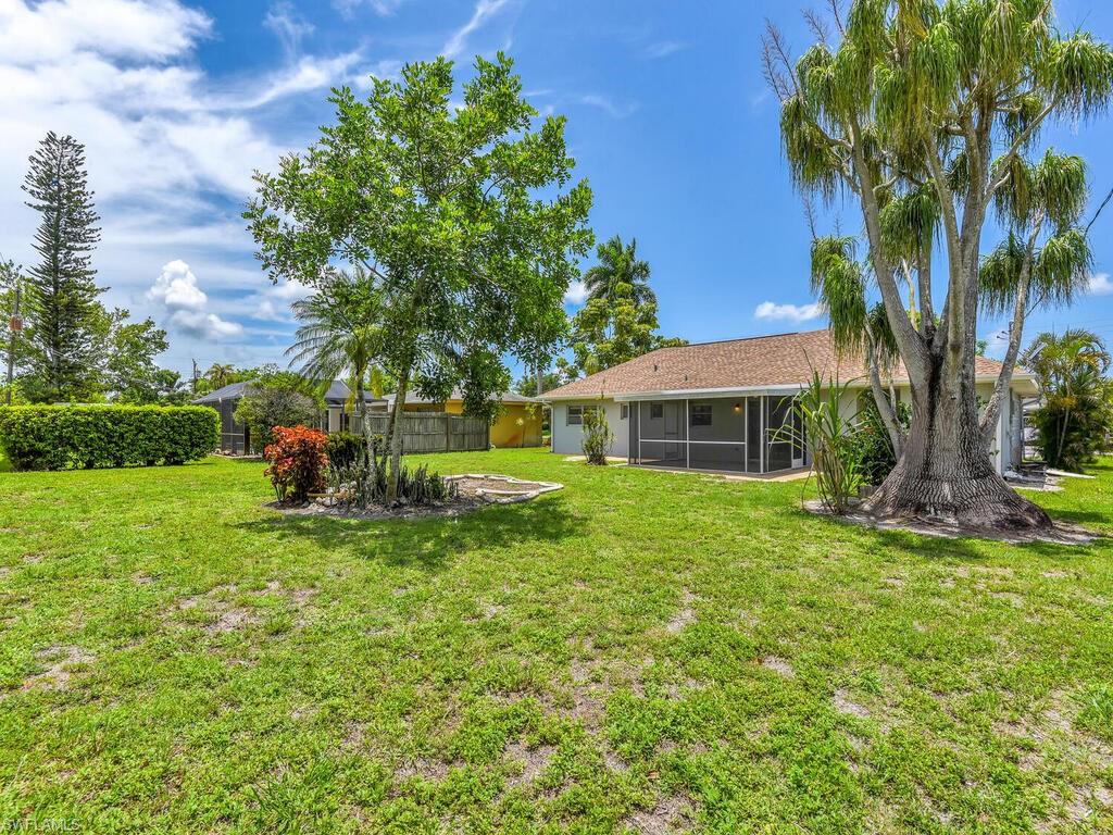 1958 41st Terrace Southwest Naples, FL 34116 - Photo 10 of 28 a view of a house with a yard