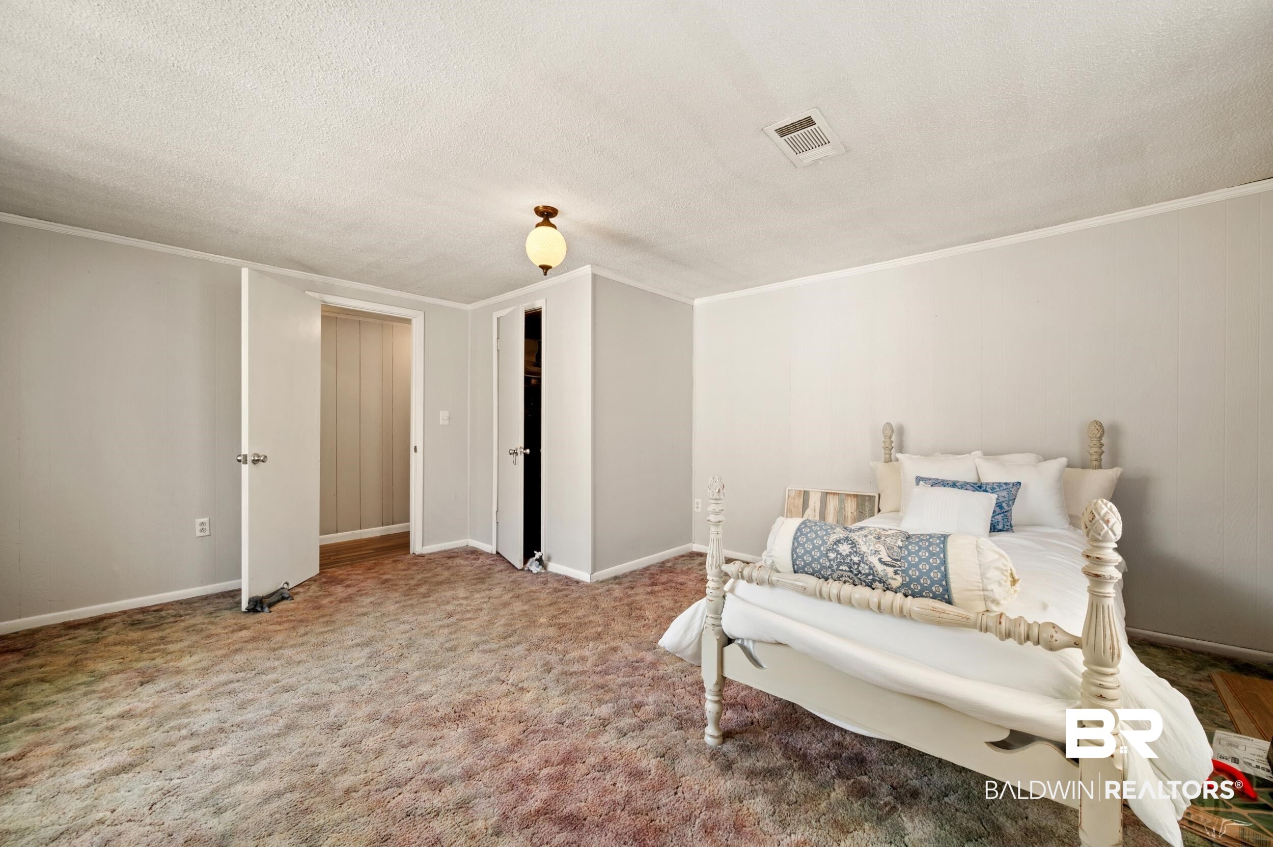57623 Mary Hadley Road Perdido, AL 36562 - Photo 14 of 34 Bedroom with carpet, a textured ceiling, and crown molding