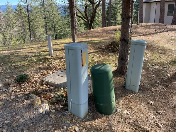 an aerial view of a house with outdoor space and sitting area
