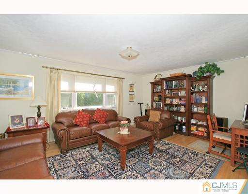 15 King Road Somerset, NJ 08873 - Photo 2 of 8 a living room with furniture and a window