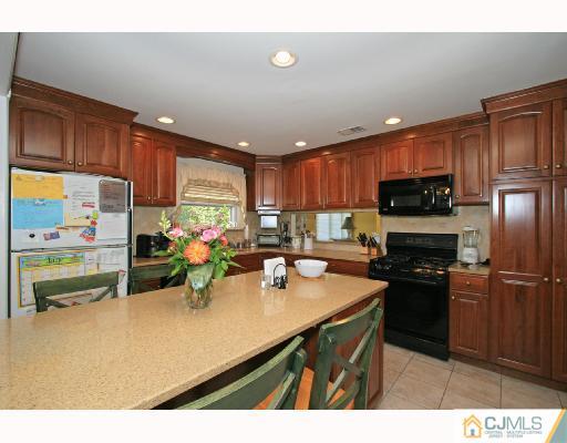 15 King Road Somerset, NJ 08873 - Photo 4 of 8 a kitchen with a sink appliances and cabinets