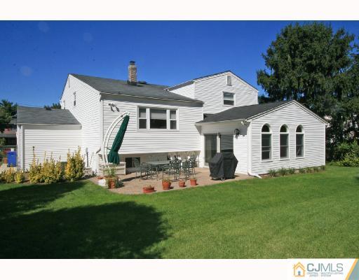 15 King Road Somerset, NJ 08873 - Photo 8 of 8 a front view of a house with a garden and yard