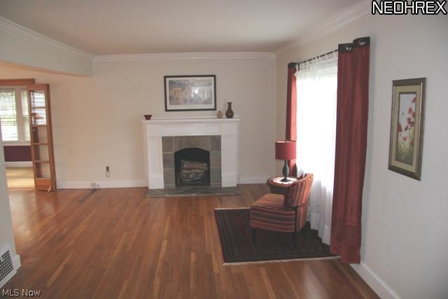 2591 Eaton Road Cleveland, OH 44118 - Photo 3 of 17 Living room includes a feature fireplace, beautiful hardwood floors, lots of sunlight and opens to the dining room.