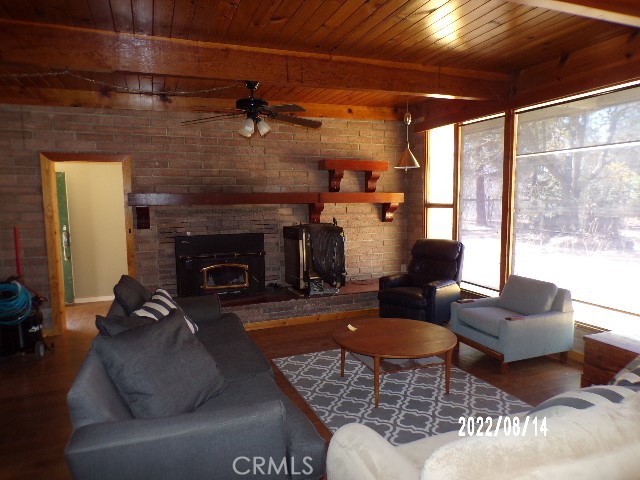 13425 Jensen Road Clearlake Oaks, CA 95423 - Photo 8 of 14 a living room with furniture and a fireplace