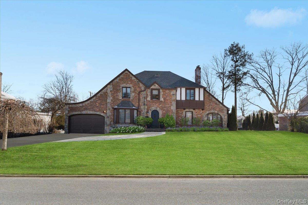 a front view of house with yard and green space