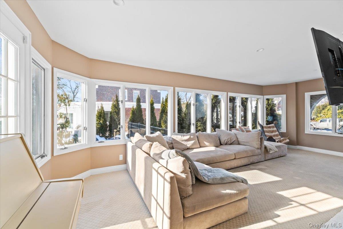 25 Pond Park Road Great Neck, NY 11023 - Photo 12 of 45 a living room with furniture and a large window