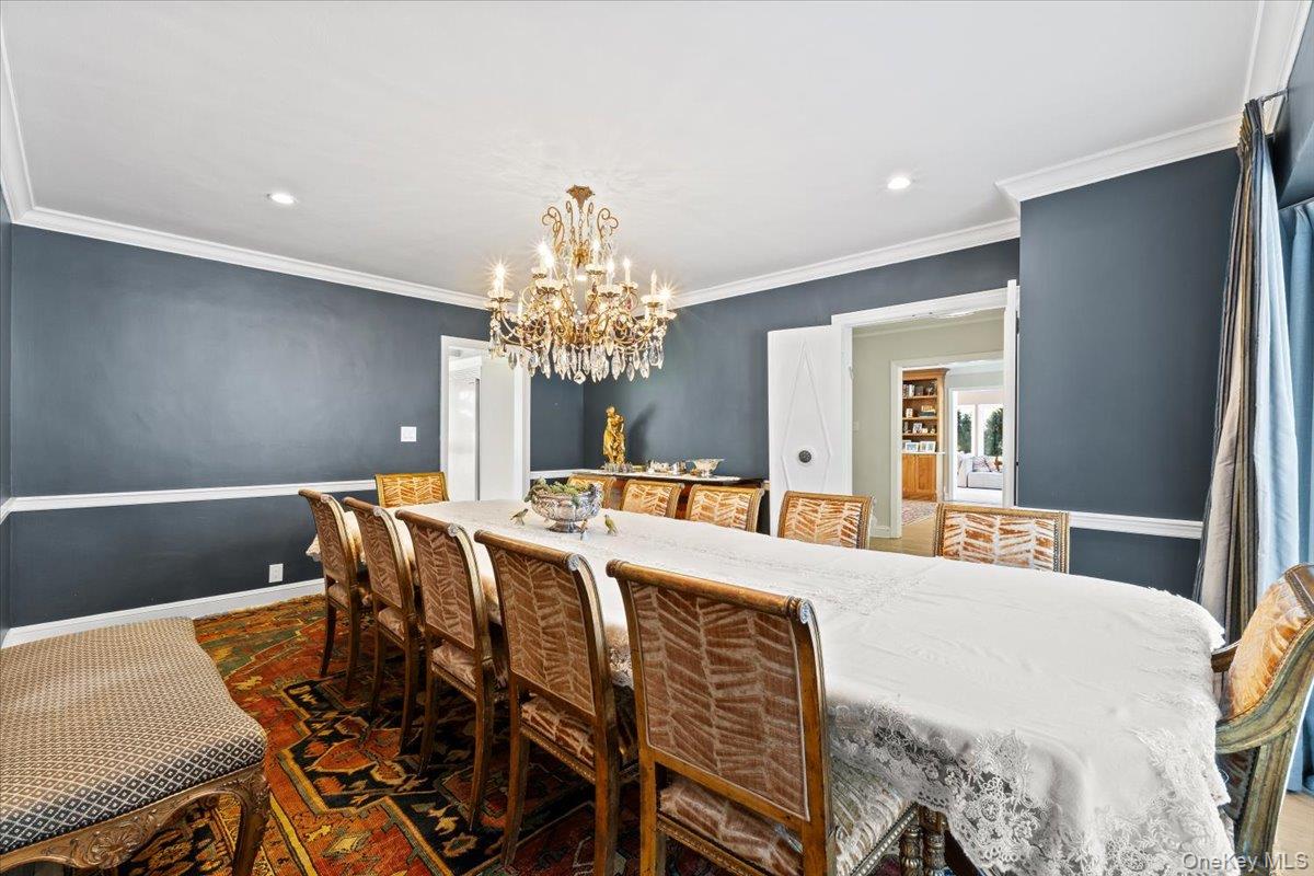25 Pond Park Road Great Neck, NY 11023 - Photo 13 of 45 a view of a dining room with furniture and chandelier