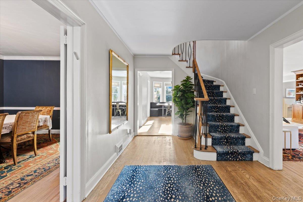 25 Pond Park Road Great Neck, NY 11023 - Photo 2 of 45 a view of a hallway view with staircase and living room