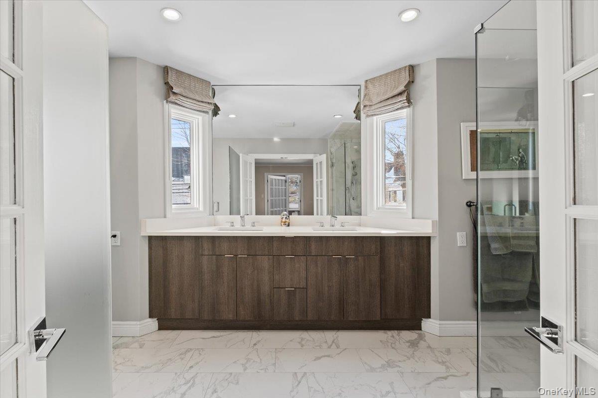 25 Pond Park Road Great Neck, NY 11023 - Photo 26 of 45 a bathroom with a sink and a mirror