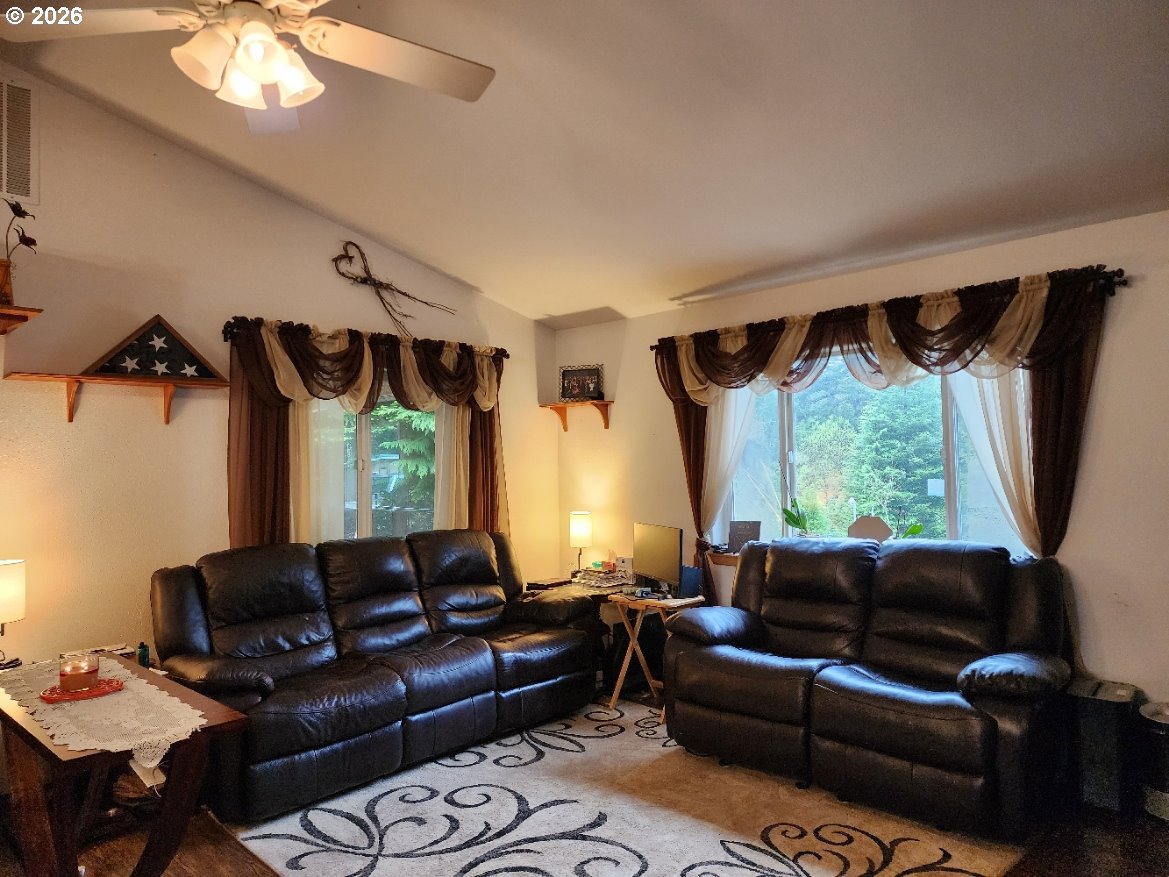 93490 Fir Road Port Orford, OR 97465 - Photo 13 of 47 a living room with furniture and a large window