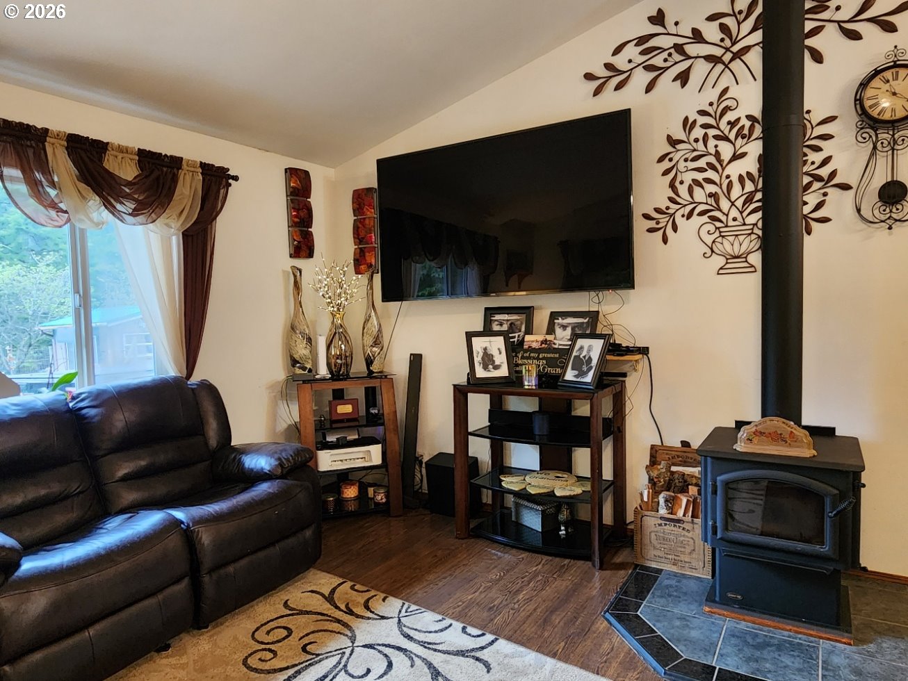93490 Fir Road Port Orford, OR 97465 - Photo 15 of 47 a living room with furniture and a flat screen tv