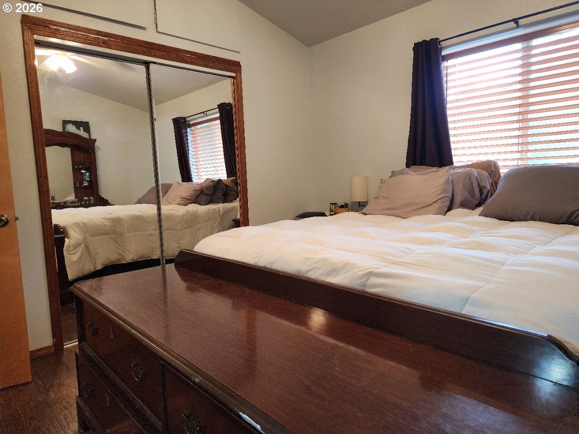 93490 Fir Road Port Orford, OR 97465 - Photo 16 of 47 a bedroom with a bed and window