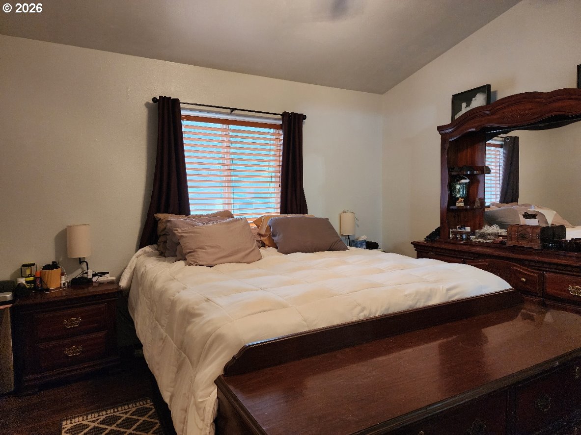 93490 Fir Road Port Orford, OR 97465 - Photo 17 of 47 a bedroom with a bed and a dresser