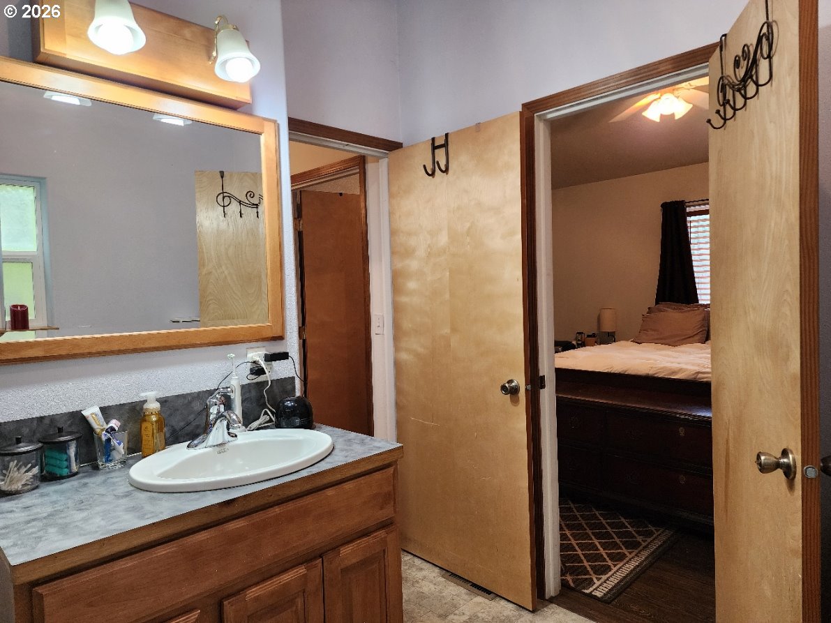 93490 Fir Road Port Orford, OR 97465 - Photo 19 of 47 a bathroom with a sink and mirror