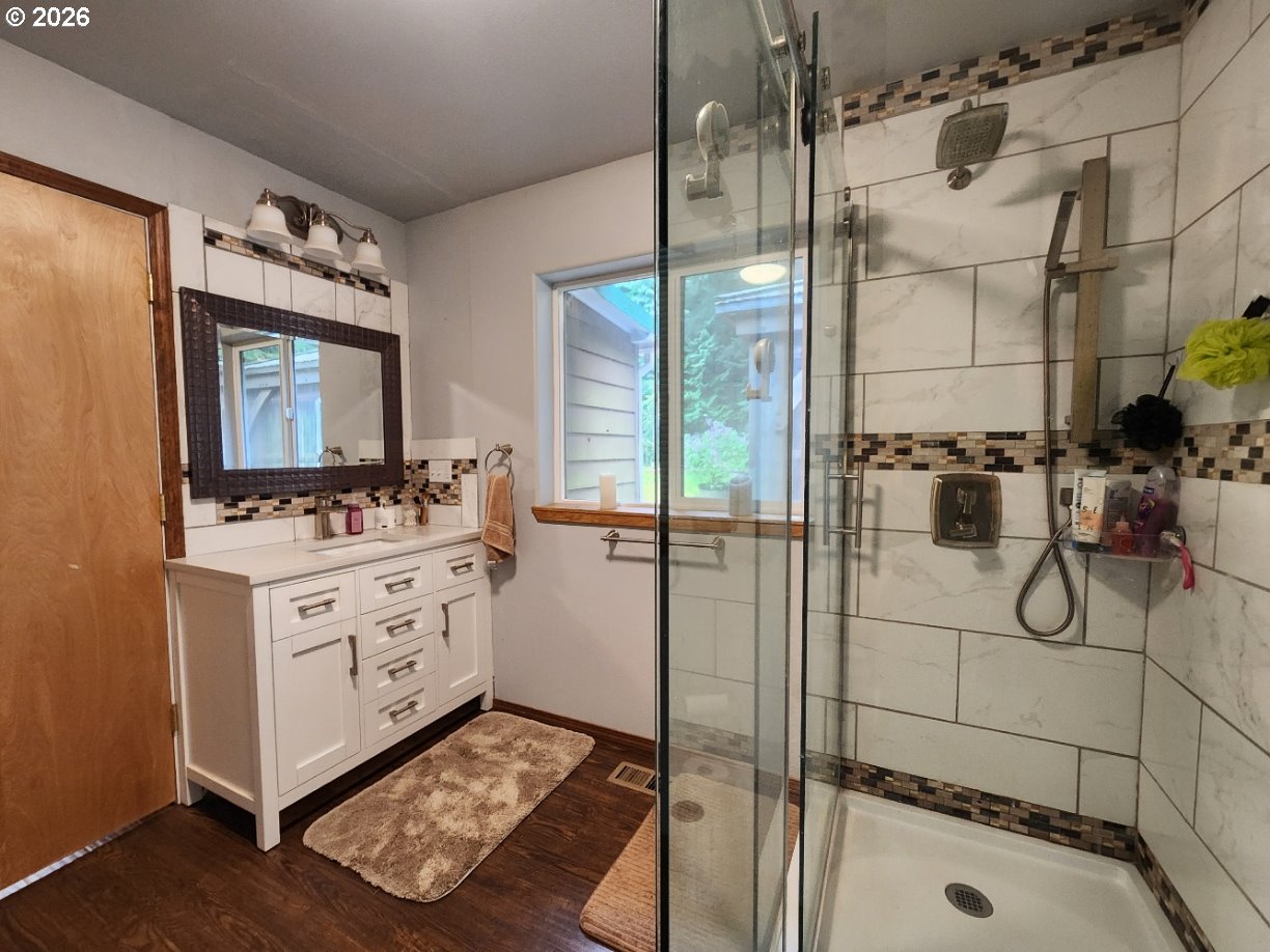 93490 Fir Road Port Orford, OR 97465 - Photo 21 of 47 a bathroom with a tub sink mirror and shower