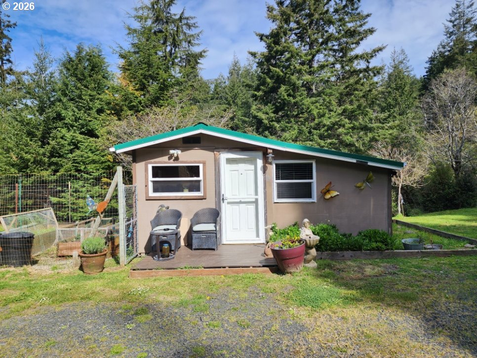 93490 Fir Road Port Orford, OR 97465 - Photo 26 of 47 a view of a house with backyard