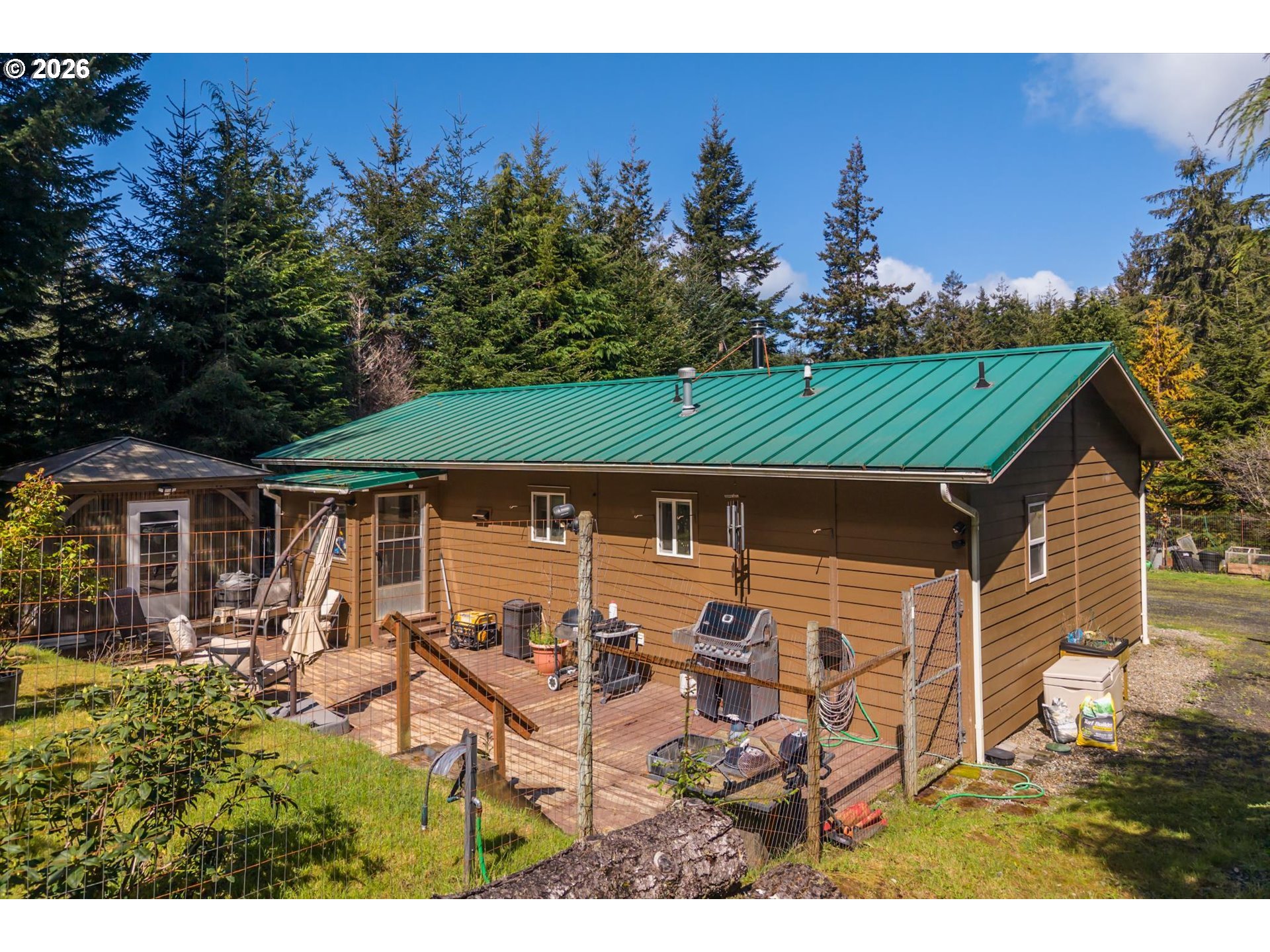 93490 Fir Road Port Orford, OR 97465 - Photo 36 of 47 an outdoor space with seating area and trees