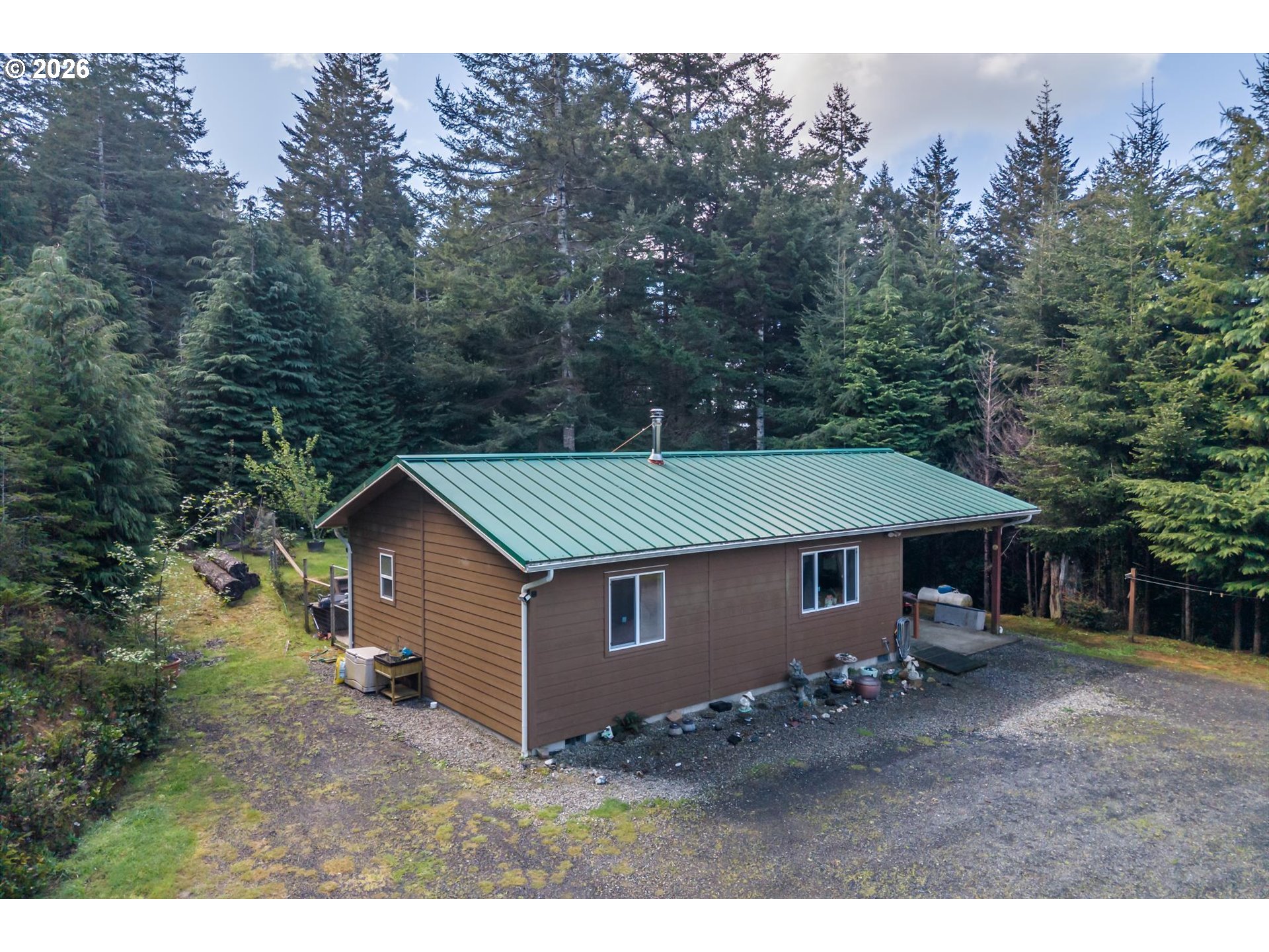 93490 Fir Road Port Orford, OR 97465 - Photo 38 of 47 a house with trees in the background