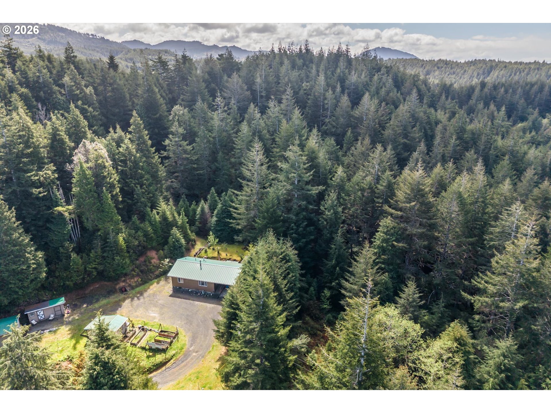 93490 Fir Road Port Orford, OR 97465 - Photo 40 of 47 a view of a mountain with a trees