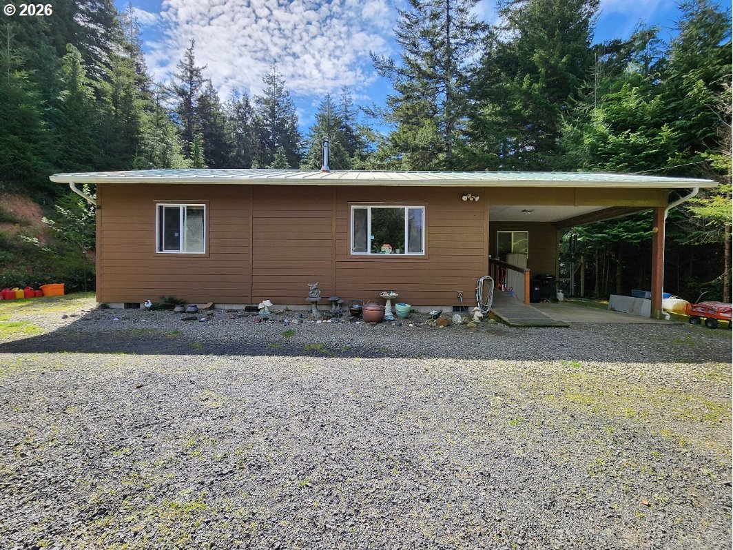 93490 Fir Road Port Orford, OR 97465 - Photo 46 of 47 a front view of house with yard