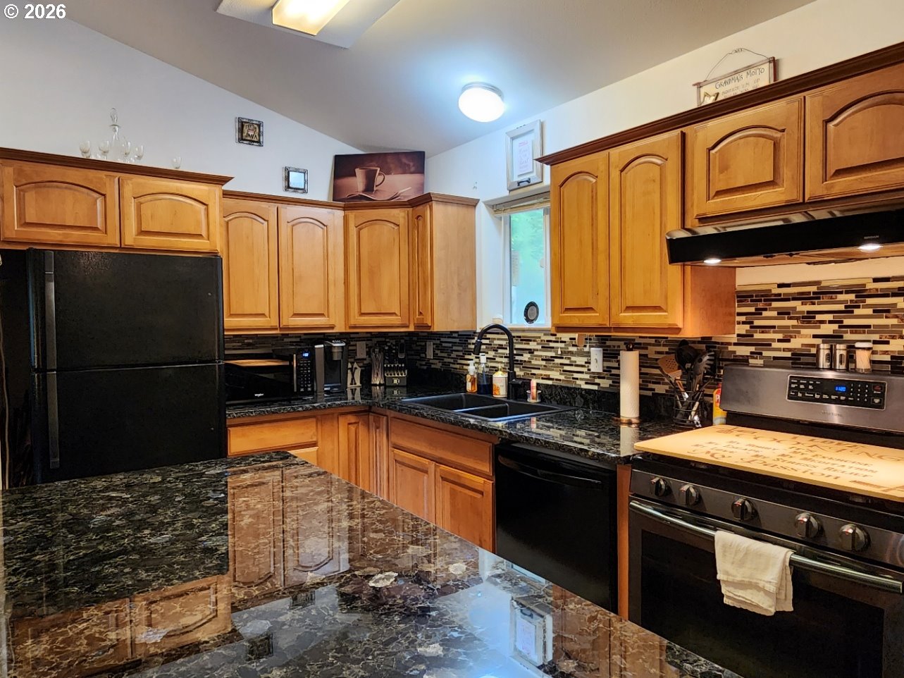 93490 Fir Road Port Orford, OR 97465 - Photo 8 of 47 a kitchen with stainless steel appliances granite countertop a refrigerator a stove and a sink