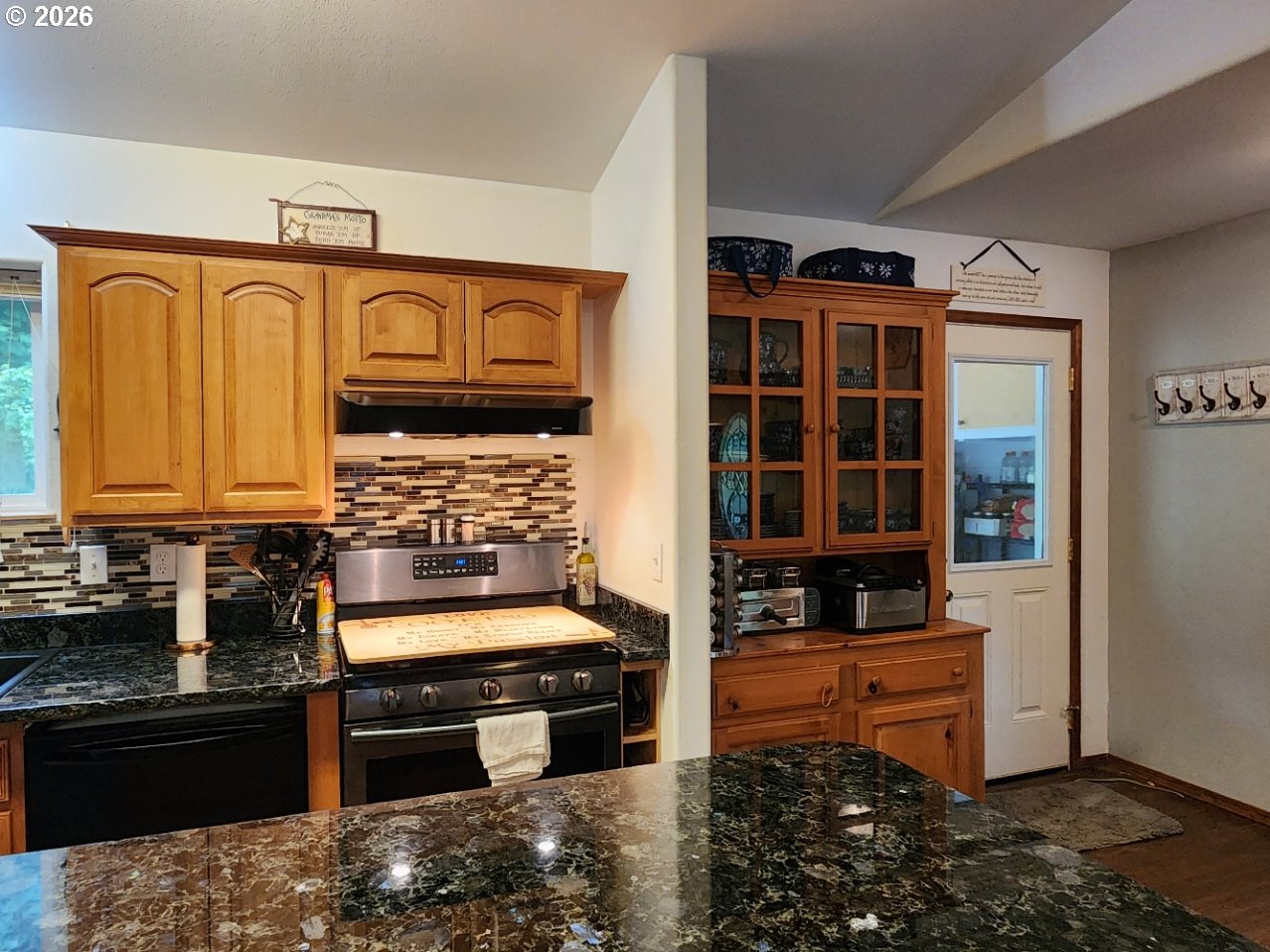 93490 Fir Road Port Orford, OR 97465 - Photo 10 of 47 a kitchen with granite countertop a stove and a refrigerator