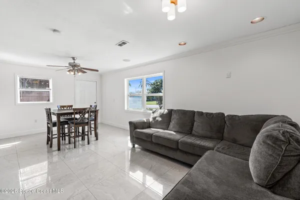 a living room with furniture and a window