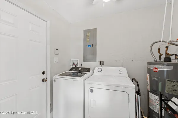 a utility room with dryer and washer