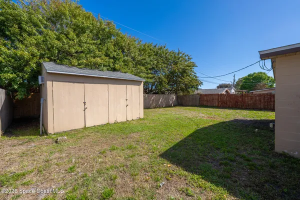 a view of a backyard with a garden
