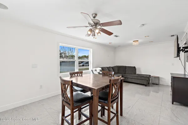 a view of a dining room with furniture