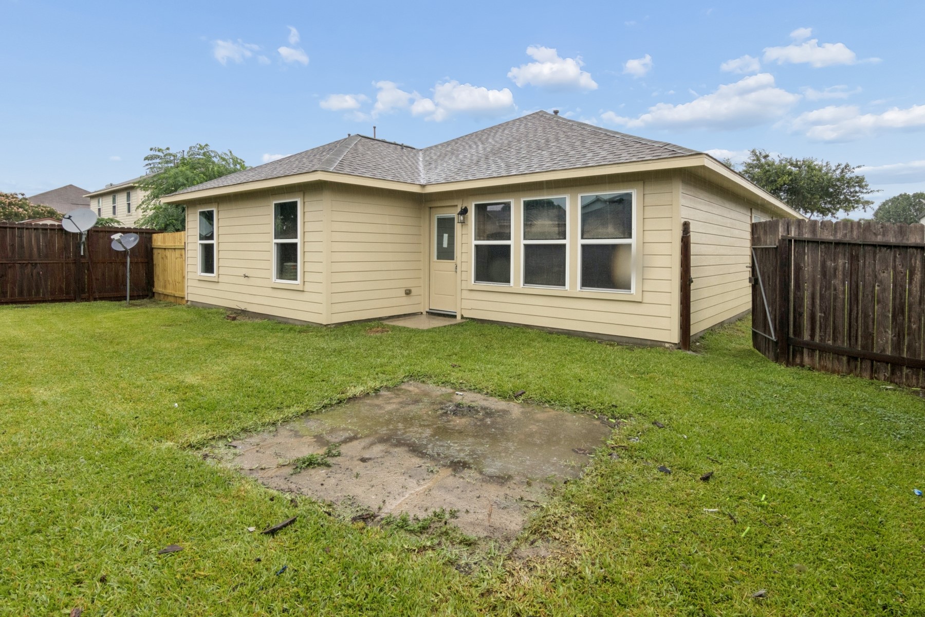 7811 Adonis Avenue Baytown, TX 77521 - Photo 35 of 36 a view of a yard in front of a house with large trees