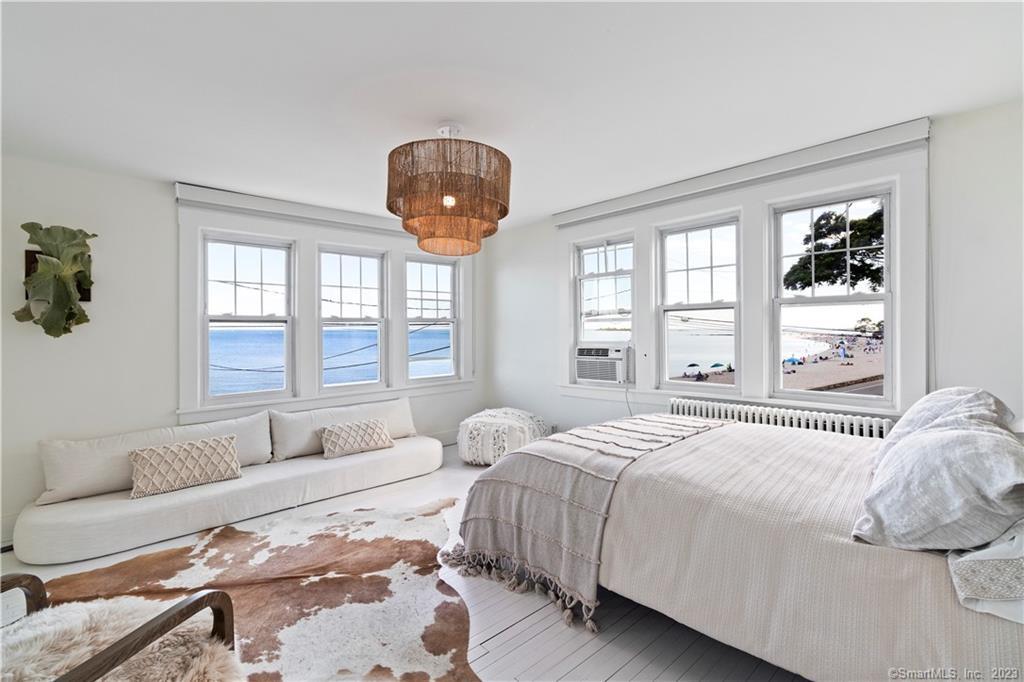 19 Soundview Drive Westport, CT 06880 - Photo 12 of 40 a spacious bedroom with a bed and a large window