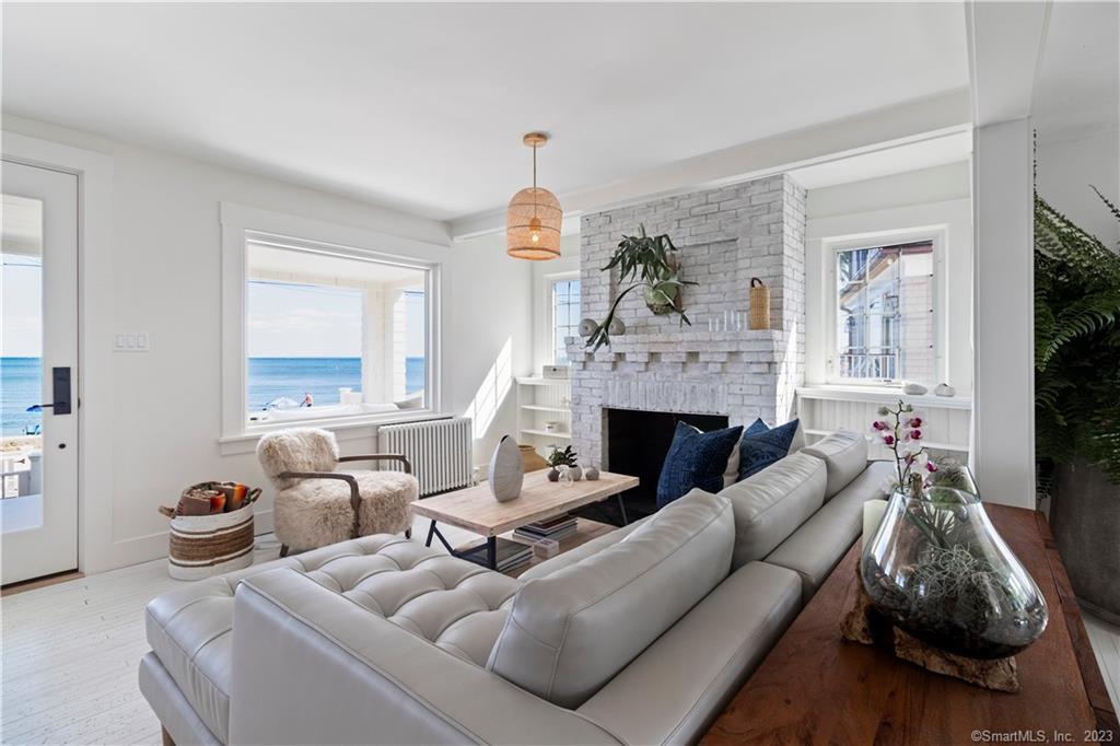 19 Soundview Drive Westport, CT 06880 - Photo 13 of 40 a living room with furniture a fireplace and a window