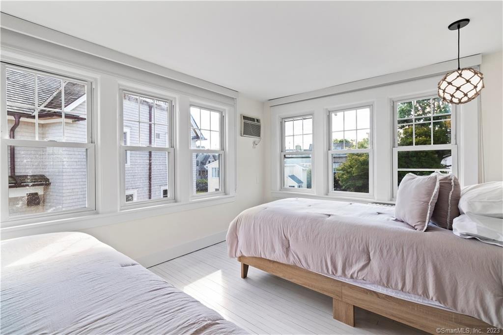 19 Soundview Drive Westport, CT 06880 - Photo 20 of 40 a bedroom with a large bed and a large window