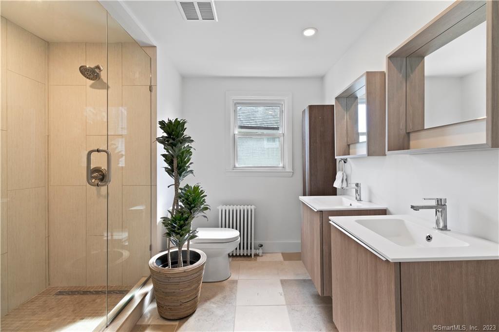 19 Soundview Drive Westport, CT 06880 - Photo 21 of 40 a bathroom with a potted plant and a sink