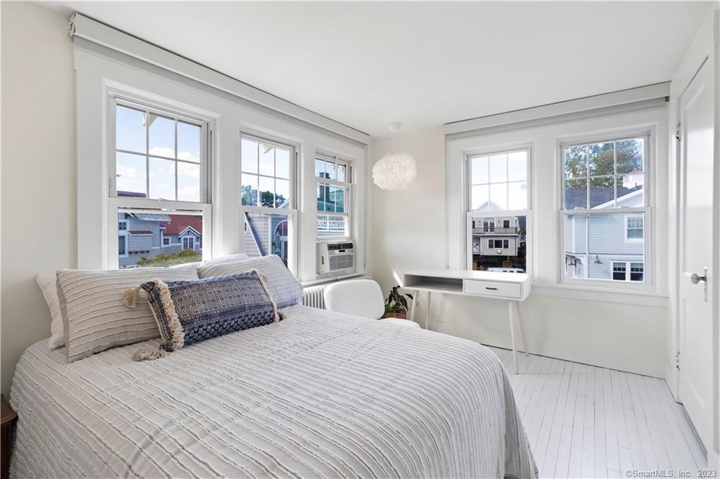 19 Soundview Drive Westport, CT 06880 - Photo 27 of 40 a bedroom with a large bed and a window