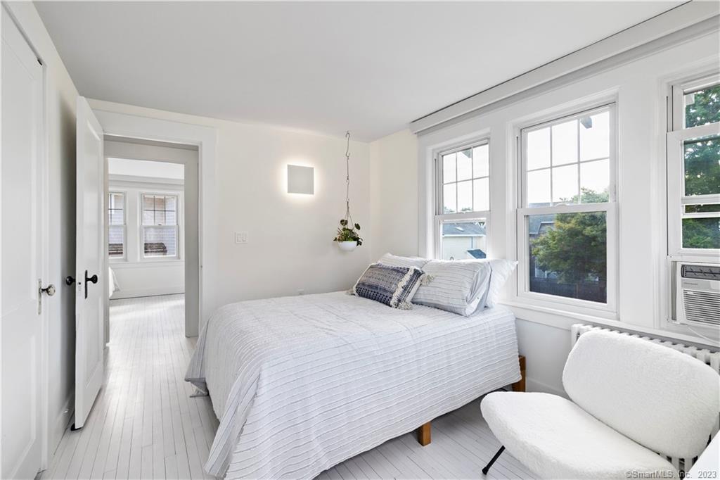 19 Soundview Drive Westport, CT 06880 - Photo 28 of 40 a bedroom with a bed and glass window