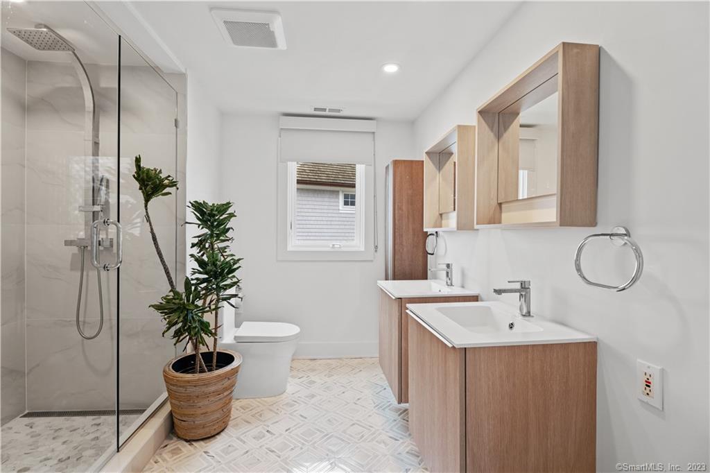 19 Soundview Drive Westport, CT 06880 - Photo 39 of 40 a bathroom with a potted plant and a sink